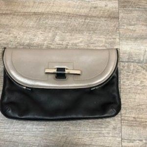 Jimmy Choo Two Tone Clutch with slid bar closure and zipper edging